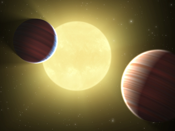 Planetární soustava u hvězdy Kepler-9 v představách malíře. Credit: NASA/Ames/JPL-Caltech