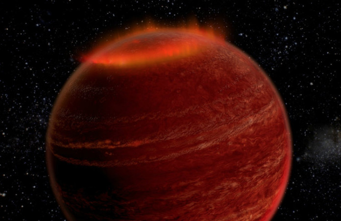 Polární záře v atmosféře hnědého trpaslíka. Credit: Chuck Carter and Gregg Hallinan/Caltech