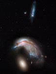 Kolize dvou galaxií se souhrnným označením Arp 142 na snímku z Hubblova dalekohledu. Credit: NASA, ESA