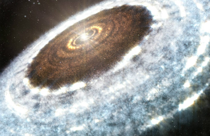 Disk u V883 Orionis v představách malíře. Credit: A. Angelich (NRAO/AUI/NSF)/ALMA (ESO/NAOJ/NRAO)
