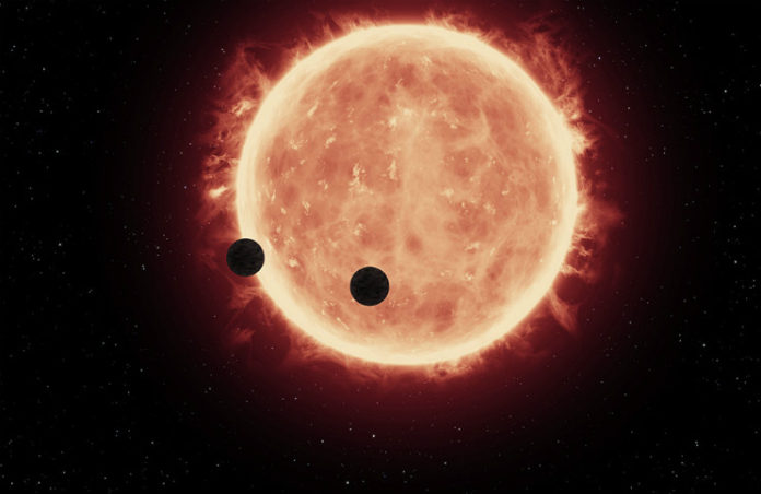 Exoplanety u červeného trpaslíka. credit: NASA, ESA, and G.Bacon (STScI).