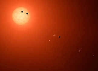 Mohly by mít planety u TRAPPIST-1 měsíce? Credit NASA/JPL-Caltech/R. Hurt (IPAC)