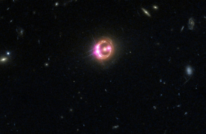 Čočkovaný kvasar RXJ1131-1231. Credit: NASA/CXC/Univ of Michigan/R.C.Reis et al
