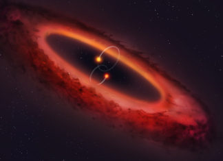 Dvě hvězdy obklopuje velké ruské kolo z prachu a plynu. Mohou v něm vznikat planety Polární protoplanetární disk. Credit: University of Warwick/Mark Garlick.